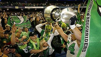 Saskatchewan's Jeremy O'Day lifts the Grey Cup following the Roughriders' victory over the Winnipeg Blue Bombers in 2007.