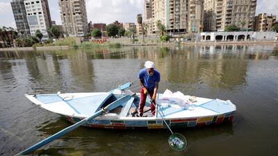 Fisherman Mohamed Nasar, 59, uses his boat to collect plastic garbage from the Nile river for The VeryNile NGO, three generations of Nassar's family are taking part in the environment friendly initiative in Giza, Egypt, October 19, 2022. REUTERS / Mohamed Abd El Ghany
