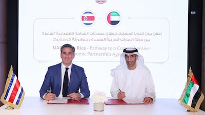 Dr Thani Al Zeyoudi, UAE Minister of State for Foreign Trade, and Manuel Rivera, Minister of Foreign Trade of the Republic of Costa Rica, sign a joint statement marking the launch of preliminary Cepa talks. Photo: UAE Ministry of Economy
