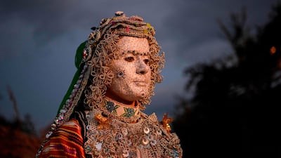 Buqaj looks on after receiving a traditional face painting. AFP