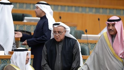 Kuwaiti MP Nabil Al Fadhel (C) speaks to prime minister Sheikh Jaber Al Mubarak Al Sabah (L) and foreign minister Sheikh Sabah Al Khaled Al Sabah at the national assembly in Kuwait City on December 22. Yasser Al Zayyat / AFP Photo