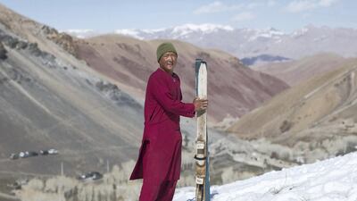 Nasrullah 16 stands for a picture after the wooden ski race. Rick Findler for The National