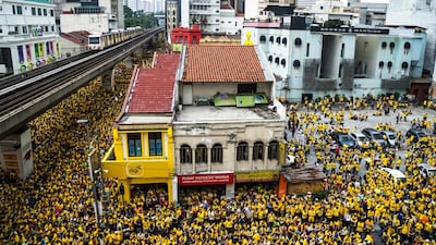 A KL Monorail train operated by Rapid Rail Sdn Bhd. travels along an elevated track as protesters gather during the Coalition for Clean and Fair Elections rally, also known as Bershih, near the Jamek Mosque in Kuala Lumpur, Malaysia, on Saturday, August 29, 2015. Malaysian security forces tightened control of Kuala Lumpur, deploying water cannons and riot police as thousands of protesters headed to the historic Independence Square to demand Prime Minister Najib Razak’s resignation. Sanjit Das / Bloomberg