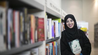Eiman Al Zaabi holding her self-help book, which is launched tomorrow. Mona Al Marzooqi / The National