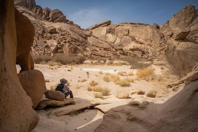 A hiker in Saudi Arabia's mountain canyons. The Kingdom is set to launch tourism visas imminently. Courtesy The Red Sea Development Company
