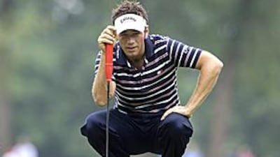 Nick Dougherty checks the green at the sixth hole during the final day of the International Golf Open in Moosinning-Eichenried.