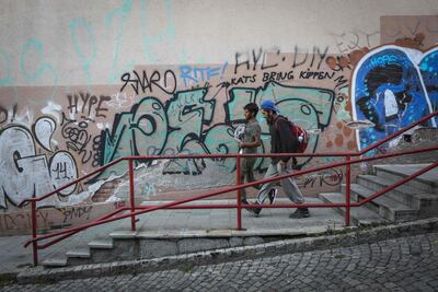 A group of migrants walk in downtown Belgrade, on August 19, 2020. Although the so-called Balkan route was officially closed after the peak of Europe's refugee crisis five years ago, the region is seeing a fresh tide of travellers, even amid the coronavirus pandemic. AFP