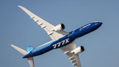 A Boeing 777X aircraft performs a demonstration flight at the 2021 Dubai Airshow. AFP