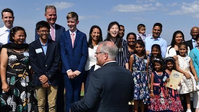 Prime Minister Scott Morrison speaks with newly sworn citizens during Australia Day Citizenship Ceremony in Canberra. EPA