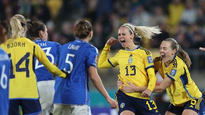 Sweden's Amanda Ilestedt, second from right, celebrates with Magdalena Eriksson after scoring her side's fourth goal againstg Italy in their Women's World Cup match in Wellington. AP