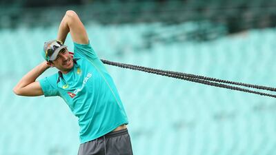 Mitchell Starc stretches during an Australian nets session at Sydney Cricket Ground on January 2. Jason McCawley / Getty Images