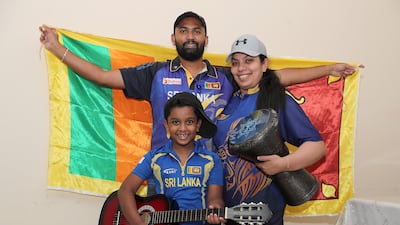 Dimantha Mark with his wife Natasha Perera and son Devin Mark, supporters of Sri Lankan cricket team with their musical instruments at their home in Sharjah. Pawan Singh/The National