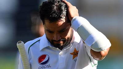 Pakistan's batsman Azhar Ali walks back to the pavilion after his dismissal off Australia's paceman Mitchell Starc on day three of the first Test. AFP