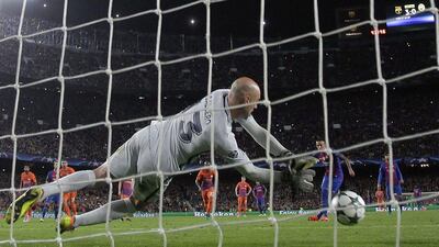 Manchester City goalkeeper Willy Caballero dives to save Neymar's penalty during the Uefa Champions League match against Barcelona. Francisco Seco / AP Photo
