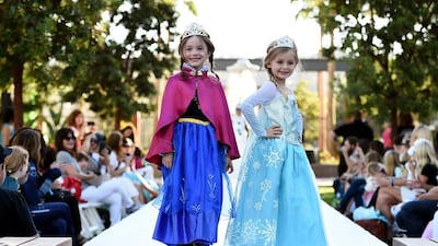 Models dressed up as (from left) Anna and Elsa from Disney’s Frozen at Disney Consumer Products’ VIP Halloween Fashion Show. AP