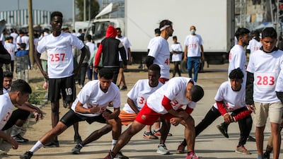 Runners stretch before the event.