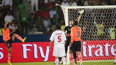 Barcelona's Pedro, left, scores the equaliser with just a minute of normal time remaining to deny Estudiantes a famous victory in the Club World Cup at Zayed Sports City last night.