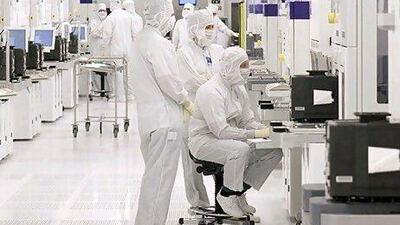 Atic accounted for 40 per cent of Mubadala's revenues. Above, engineers work in one of several clean rooms at Globalfoundries in Dresden, Germany.