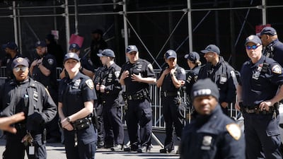 Police gather outside the courthouse, where Mr Trump will be arraigned. Getty / AFP