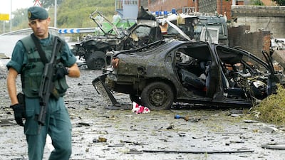 Guards inspect wreckage from car bomb in 2007, thought to have been the work of Basque separatist group Eta. Rafa Rivas / AFP