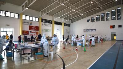 Medical staff performing swabs for Covid-19 testing in Nuoro, Italy. EPA