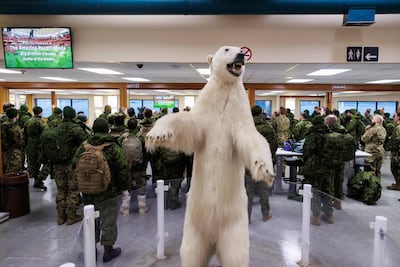 A stuffed polar bear stands at the airport as Canadian soldiers are briefed upon arrival for Operation Nanook, the Canadian Armed Forces' annual Arctic training and sovereignty operation, in Inuvik, Northwest Territories, on March 1. AFP