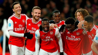 Nicolas Pepe, centre, celebrates after scoring Arsenal's second goal against Newcastle United on Sunday. AFP