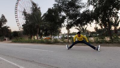 A teenager rollerblades in front of the Ferris wheel at Zawraa Park in Baghdad. Getty Images