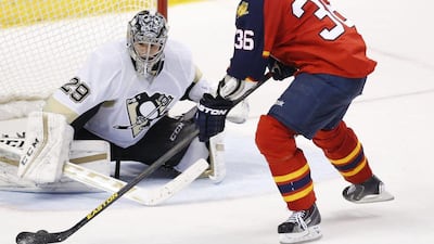 Florida Panthers player Jussi Jokinen shoots the winning shot during a shootout against the Pittsburgh Penguins on Monday. Wilfredo Lee / AP / February 15, 2016