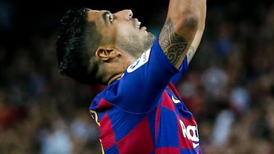 Barcelona's Uruguayan forward Luis Suarez celebrates after scoring a goal. AFP