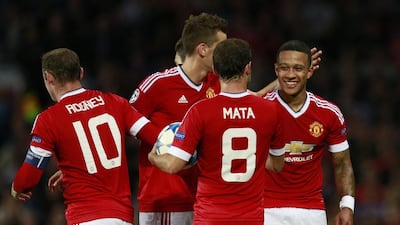 Memphis Depay celebrates with his Manchester United teammates after scoring his second goal for the club in their 3-1 Champions League play-off round first leg tie against Club Brugge on Tuesday night at Old Trafford. Jason Cairnduff / Action Images / Reuters