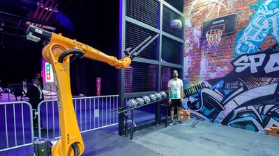 The GP World baketball robotic arm takes a shot.