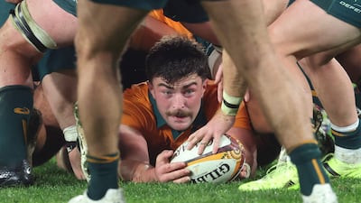 Australia's Jeremy Williams places the ball back in the ruck. AFP