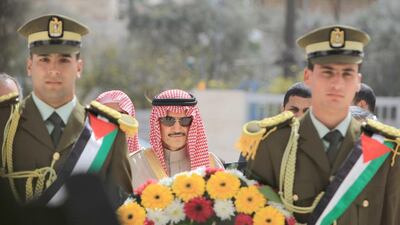 Saudi Prince Al Waleed Bin Talal lays a wreath at the grave of former Palestinian leader Yasser Arafat during an official visit to the West Bank city of Ramallah on March 4, 2014. The billionaire is in the Israeli-occupied West Bank for a meeting with Palestinian president Mahmud Abbas. Abbas Momani / AFP photo