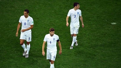 From left toright, Phil Jagielka, Steven Gerrard and Leighton Baines react after England's loss to Uruguay on Thursday at the 2014 World Cup. Matthias Hangst / Getty Images