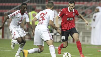 Ossama Assaidi, right, of Al Ahli in action during an Arabian Gulf League match against Sharjah at Rashid Stadium in Dubai on February 4, 2015. Hasan Alraesi / Al Ittihad