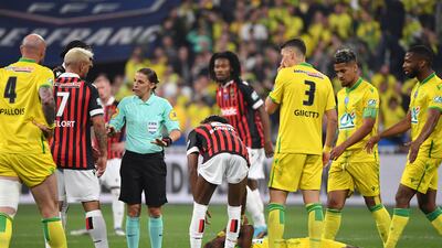 Referee Stephanie Frappart speaks with Nice forward Andy Delort. AFP