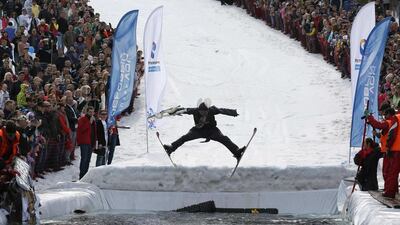 A skier jumpers into the pool at the Gornoluzhnik event. Ilya Naymushin / Reuters / April 20, 2014