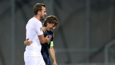 England forward Harry Kane, left, talks with Croatia midfielder Luka Modric. AFP