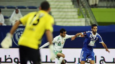 Host Al Nasr Club, in blue, played to a scoreless draw against Emirates on Saturday night. Ashraf Umrah / Al Ittihad