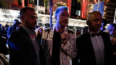 US DJ Diplo (C) leaves after attending a party. AFP