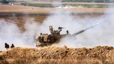 An Israeli army self-propelled howitzer fires rounds near the border with Gaza in southern Israel on Wednesday. AFP