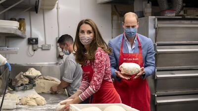 Prince William and Catherine, Duchess of Cambridge knead dough during a visit to Beigel Bake Brick Lane Bakery in September 2020 in London. The Duke and Duchess heard how the Covid-19 pandemic affected employees, as well as the ways in which the shop has helped the local community. Getty Images