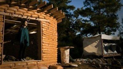 Kerry Bingham's house is made of earth-bags, which are far better for the planet than concrete.