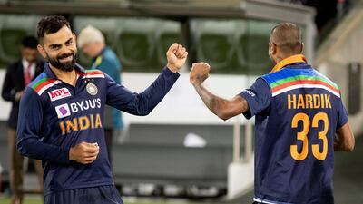 Virat Kohli with teammate Hardik Pandya in Canberra. AP