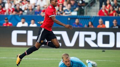Marcus Rashford slots home one of his two goals during Manchester United's win against LA Galaxy on Sunday morning. Jae C Hong / AP Photo