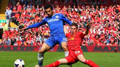 Mohamed Salah, left, of Chelsea is tackled by Jon Flanagan of Liverpool during their Premier League match at Anfield on April 27, 2014, in Liverpool, England. Clive Brunskill / Getty Images