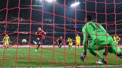 Lille's Turkish forward Burak Yilmaz scores from the penalty spot. AFP