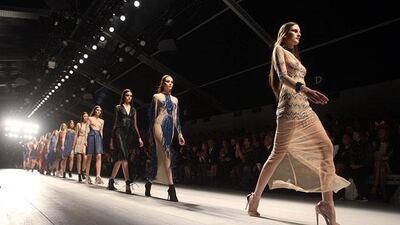 Models wear creations from Marios Schwab during London Fashion Week. Lewis Whyld / AP Photo / PA