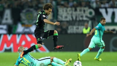 Fabian Johnson of Borussia Monchengladbach battles for the ball with Javier Mascherano of Barcelona. Alex Grimm / Getty Images